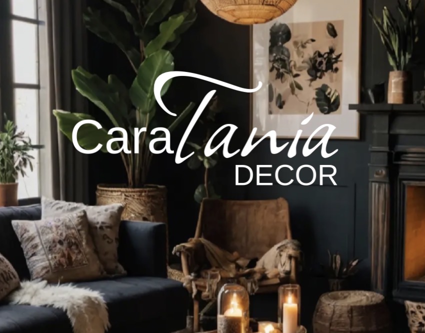 Cara Tania Décor — a warm, layered living room with dark walls, natural textures, greenery, and candlelight